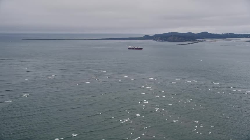Aerial view of an oil tanker approaching the Columbia River near Cape Disappointment Washington during the summer