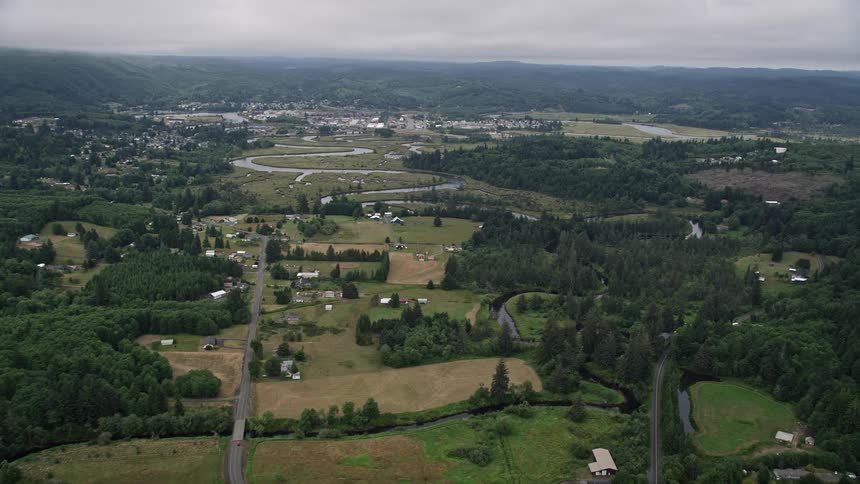 Aerial view of small farms along Fowler Road by the Willapa River near Raymond Washington showcasing the rural countryside and agricultural landscapes during the summer