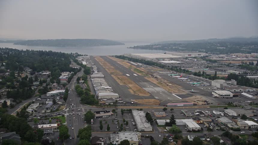 Aerial footage of a small airplane approaching the runway at Renton Municipal Airport in Washington during daytime
