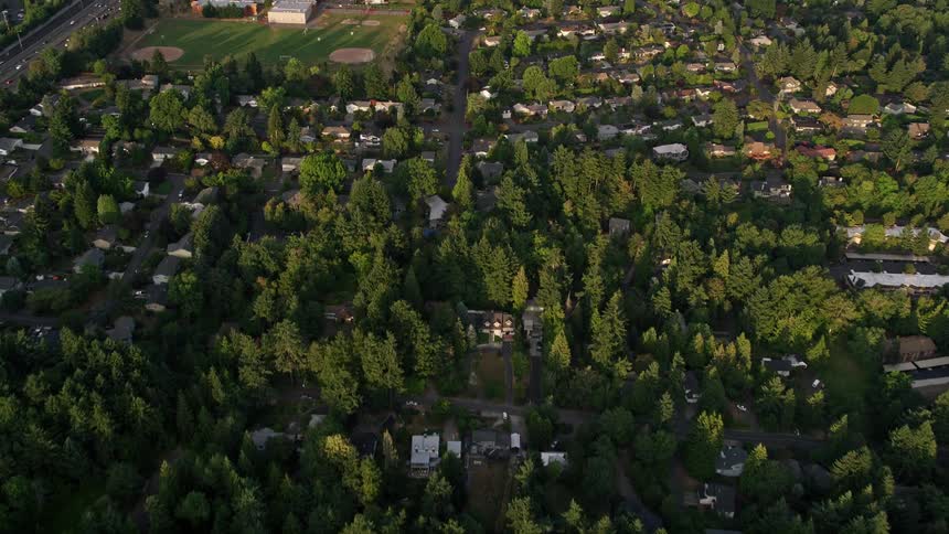 an sunset aerial view of Southwest Portland Oregon showcasing neighborhoods and West Sylvan Middle School