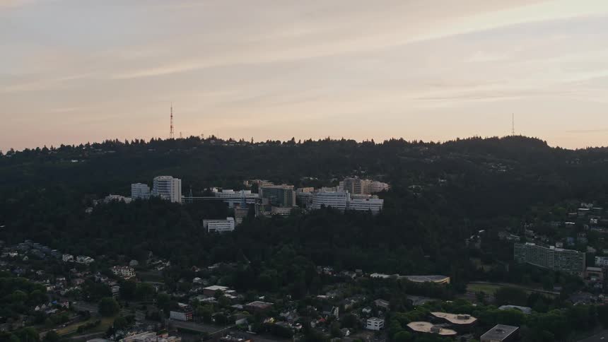 Approaching Oregon Health and Science University campus in Portland Oregon during sunset with aerial view