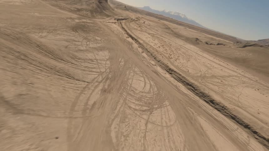 Aerial of mountain and desert landscapes during a hot day