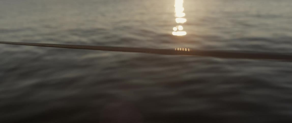 The setting sun is reflecting on the water
