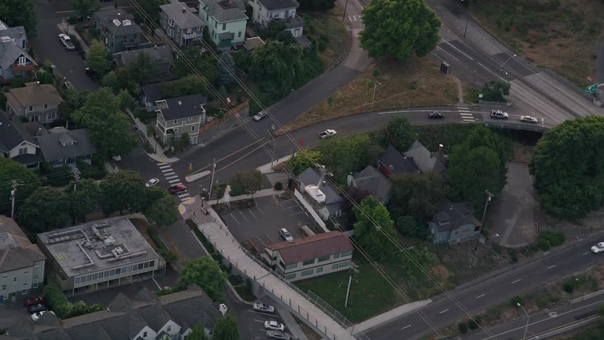Aerial footage of a cable car tracking over I-5 during twilight in Portland Oregon near Oregon Health and Science University