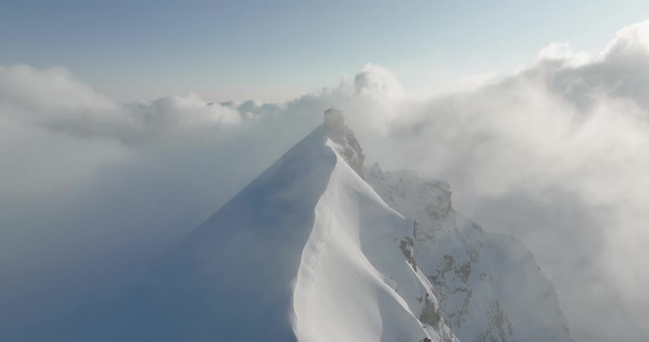 Aerial of an ice mountain with a cloudy sky at daytime