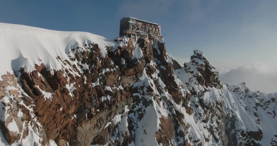 Monastery on the peak of a snow covered mountain