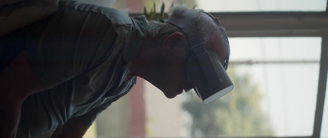 Elderly person using virtual reality glasses
