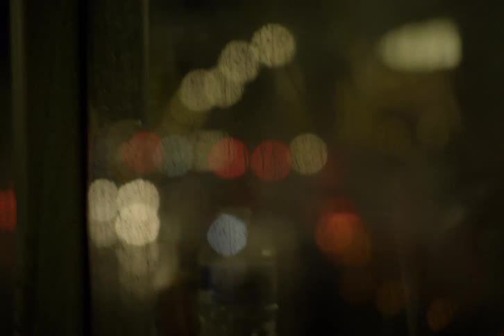Closeup of vehicle reflections and nighttime illuminations