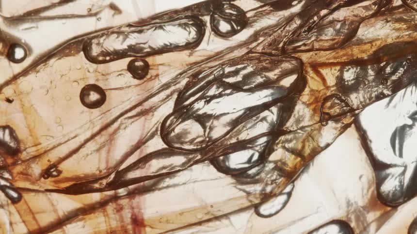 Extreme closeup of a liquid moving in bubbles in an abstract manner
