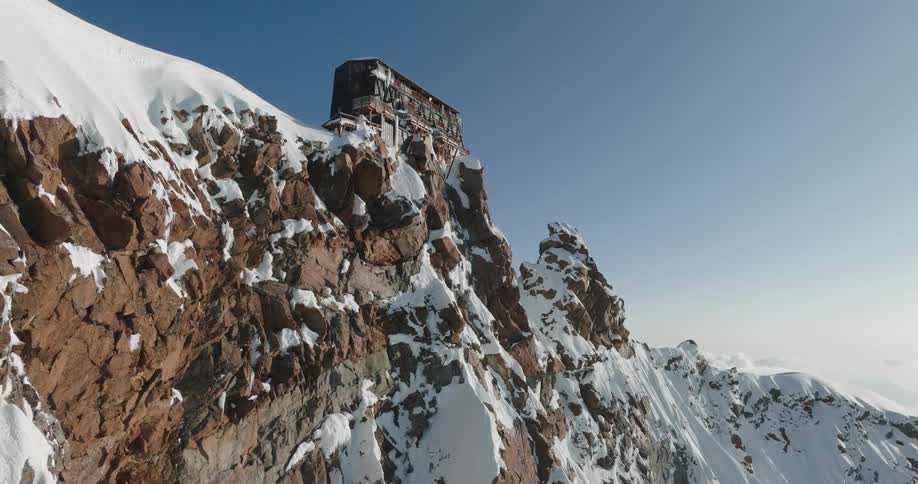 A structure is on top of the mountain