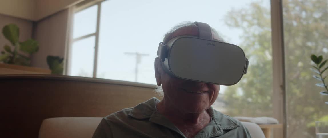 An old man enjoying a virtual reality headset