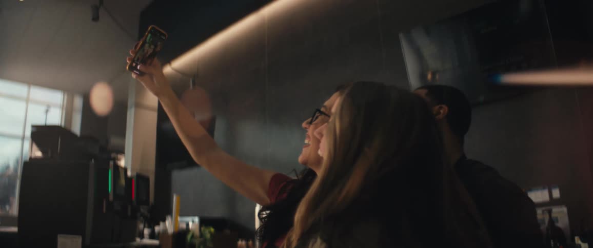 Friends taking a selfie photo in an indoor environment