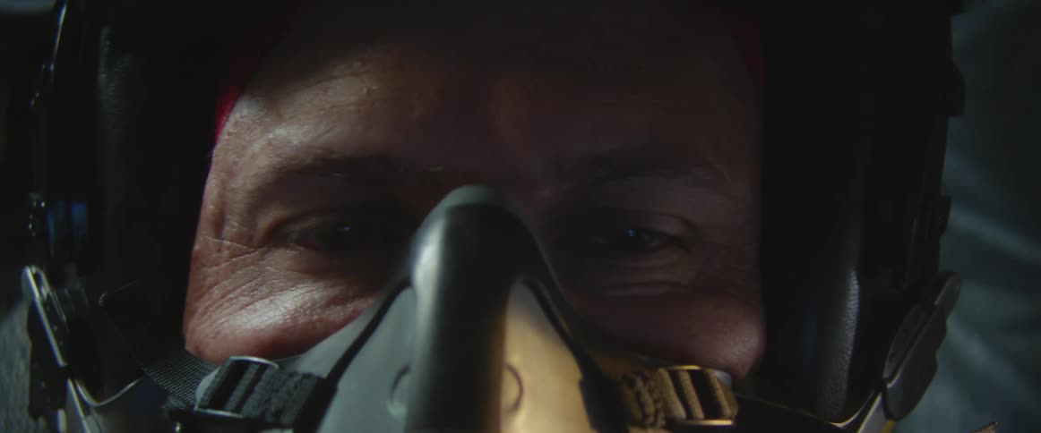 Vehicle operator wears mask and helmet