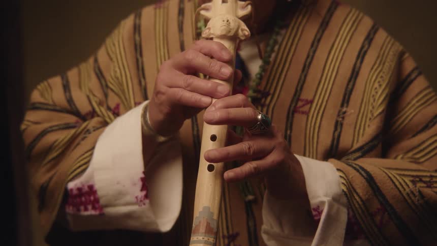 A person is playing the flute