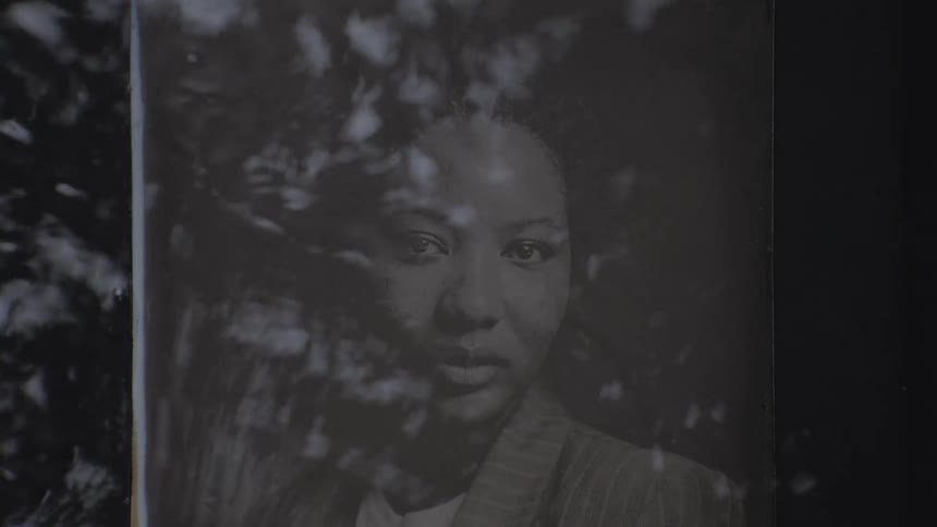 Revealing the photograph of a black woman