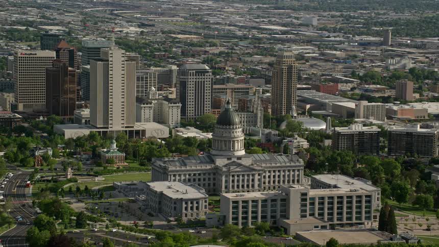 Aerial footage of Utah State Capitol Temple Square and Downtown Salt Lake City during a sunny day in the summer
