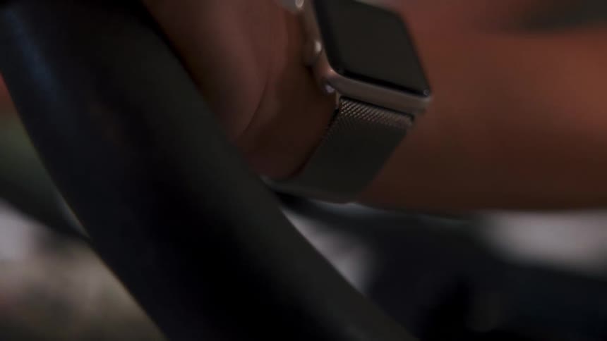 Closeup of an apple watch on a womans wrist starting an aerobic exercise on the machine