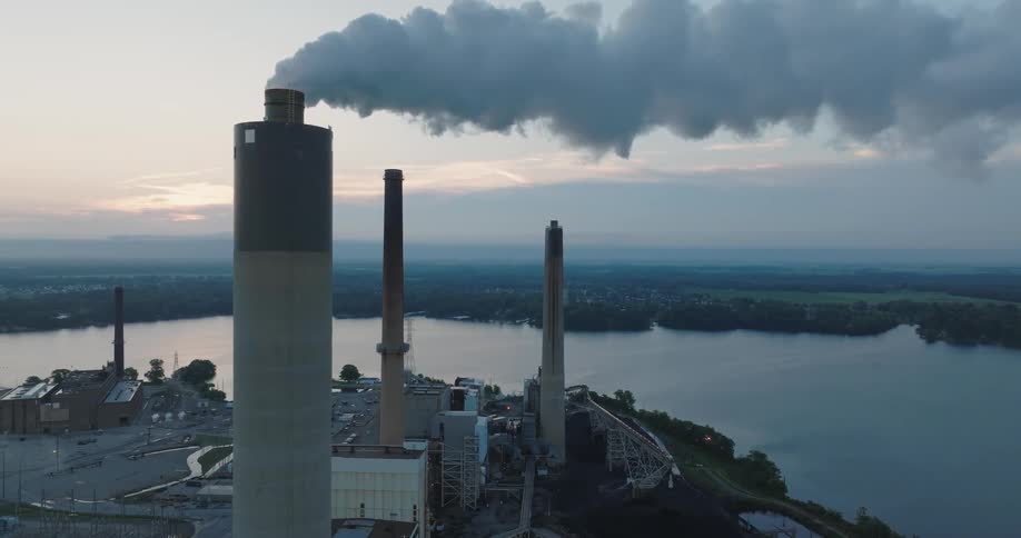 Ascending orbit around one of the stacks of a of a coal fired power plant