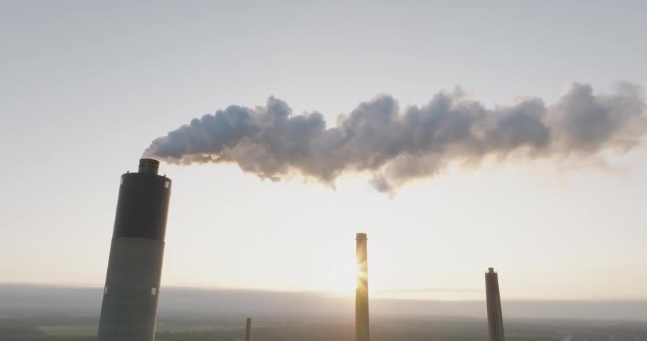 Heavy smoke comes from a power station chimney