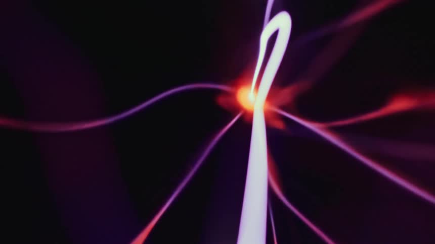 Special effects of magnetic waves in neon red and purple moving in a constant and abstract manner
