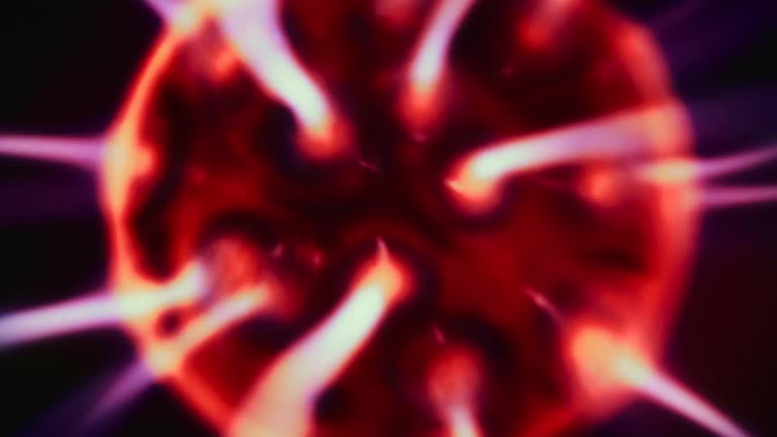 Close up of an abstract colorful circle with white beams coming out of it