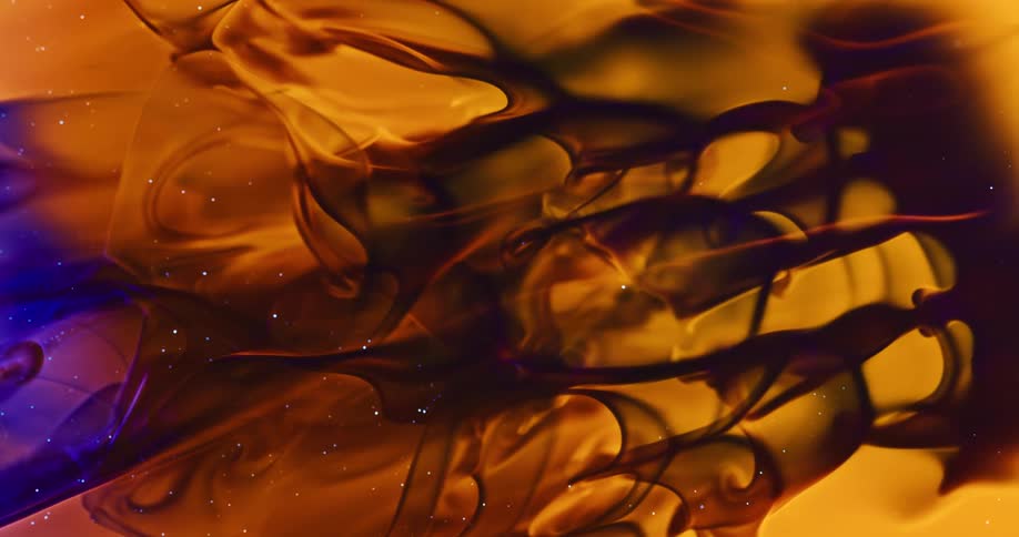 Dense and liquid texture moving slowly in abstract hues of yellow black and shimmering purple
