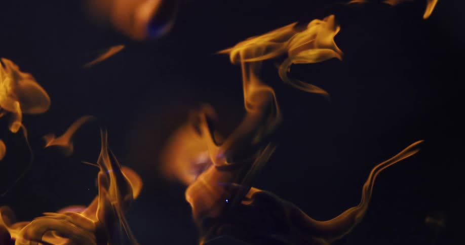 Abstract artwork on a black background with smoke moving in slow motion
