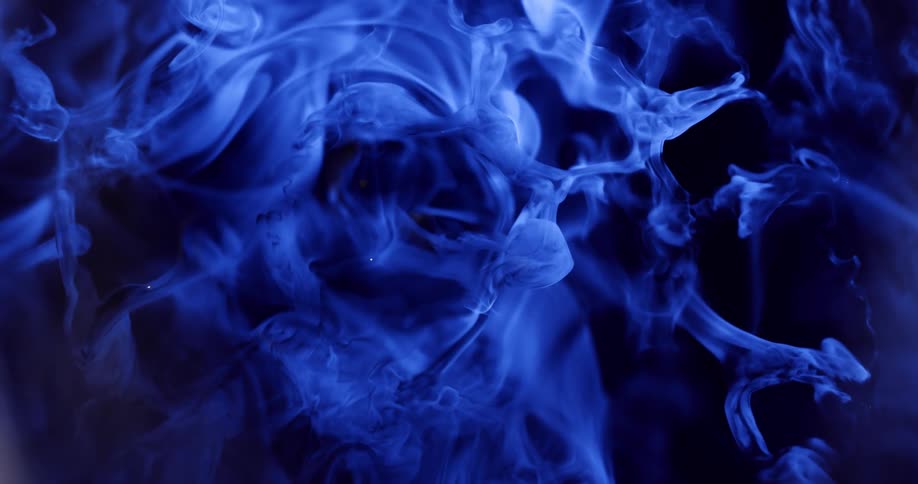 Blue smoke slowly moving in the sky