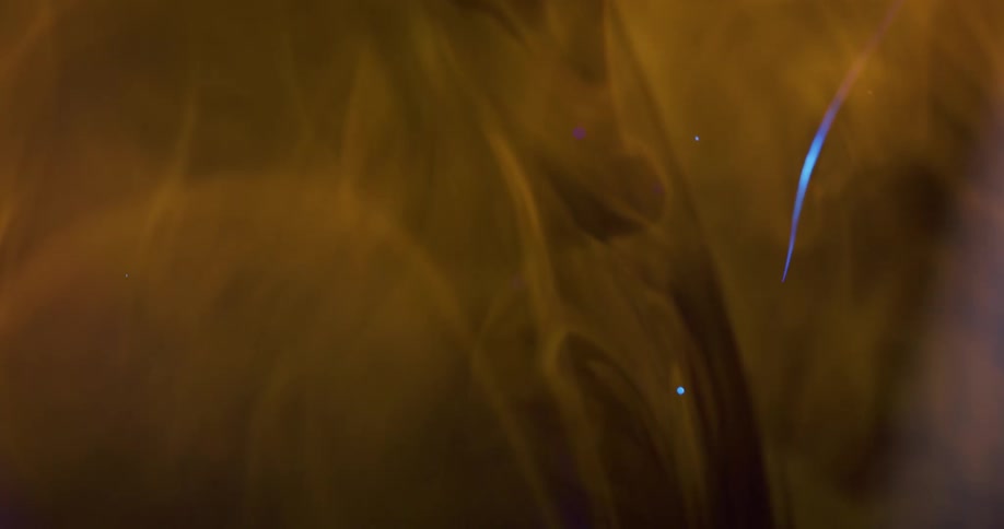 Condensed textured liquid in abstract motion with sparkling particles