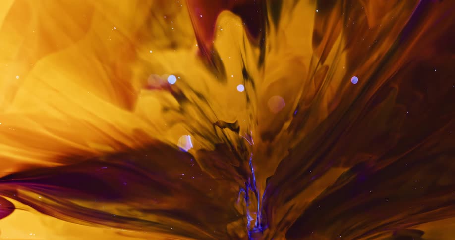 Abstract explosion within a dense liquid predominantly yellow in color with elements of black and shimmering purple