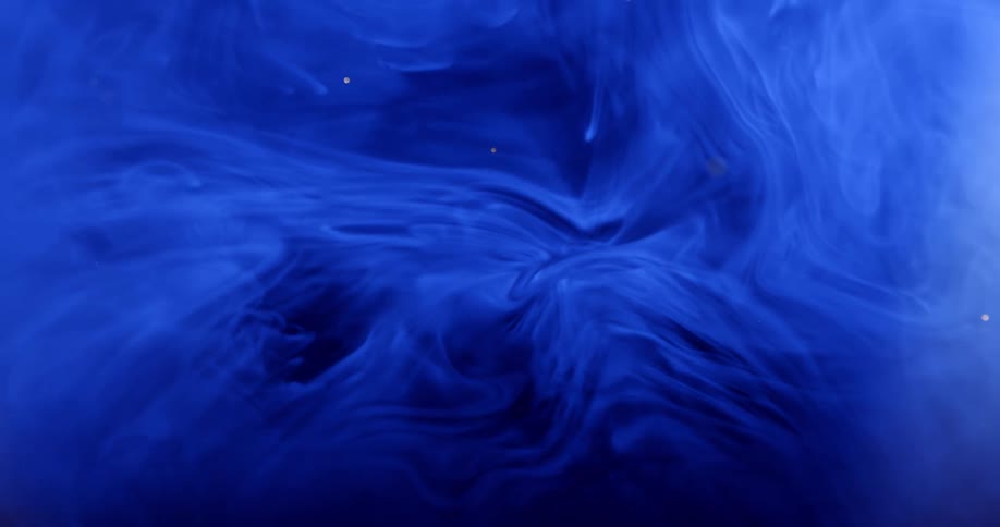 Special effect of a water droplet falling onto blue smoke