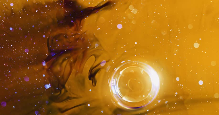 Bright bubble moves as black mixes with orange in spotted mixture
