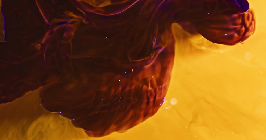 Viscous brownish liquid with shiny purple details moving within another abstract yellow liquid