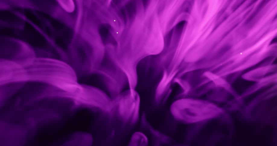 Purple smoke moves against a black background