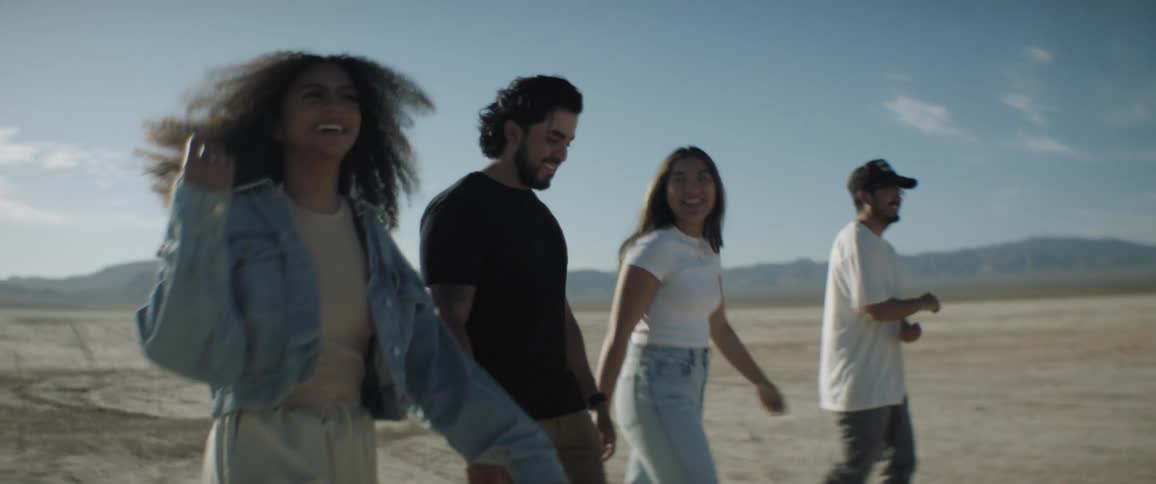 Friends are walking through the desert