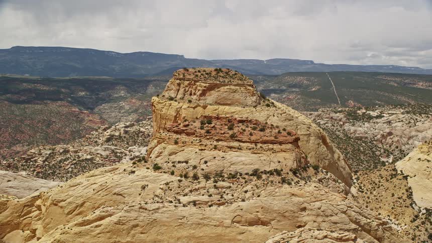 Aerial footage showcasing the stunning Waterpocket Fold rock formations in Capitol Reef National Park Utah during a sunny day in the summer