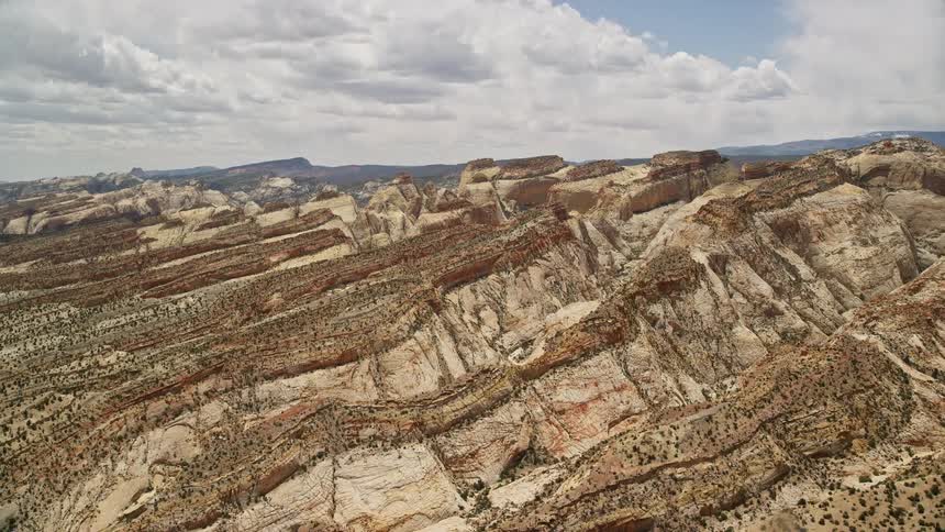 Approach the Waterpocket Fold rock formations in Capitol Reef National Park Utah with an aerial view of the magnificent Southwest United States landscape