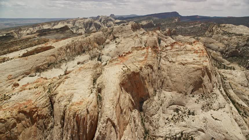 A captivating aerial view of the majestic rocky formations at Capitol Reef National Park in Utah during a sunny summer day