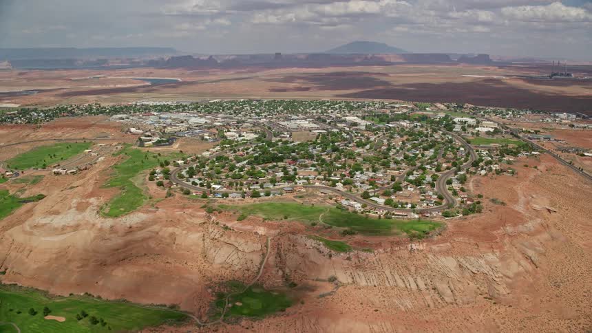 Approaching a secluded neighborhood on the outskirts of a small desert town in Page Arizona captured inaerial footage on a sunny day during summer in the Southwest United States