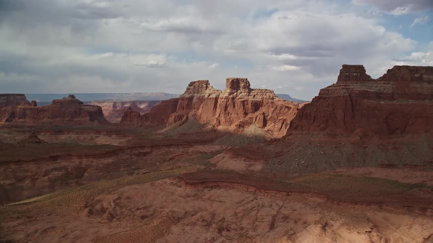an aerial view of the majestic buttes and plateaus in Navajo Nation Reservation Arizona captured during a sunny day in the summer