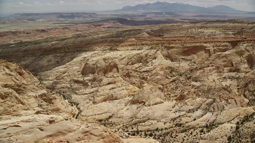 an aerial view of the Waterpocket Fold rock formations and mesas in Capitol Reef National Park Utah showcasing the stunning desert landscape and famous landmarks