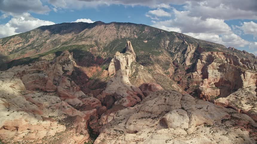 Tilting up the arid mountainside to the peak of Navajo Mountain in Utah on a sunny day