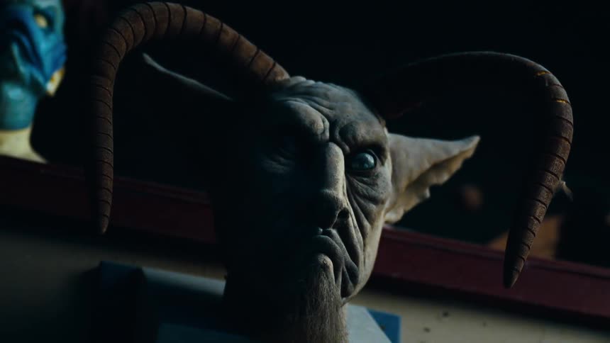 A light flashes on a spooky monster mask