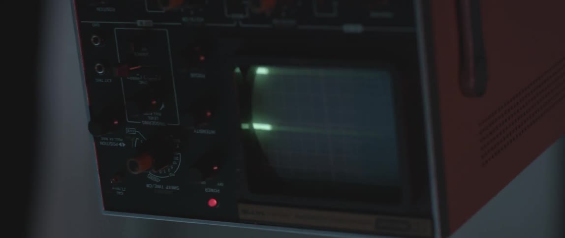 A piece of equipment with a small screen with blinking lights