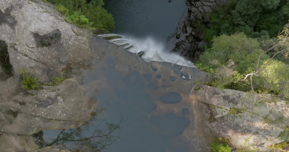 Aerial view of a waterfall in free fall with a significant height