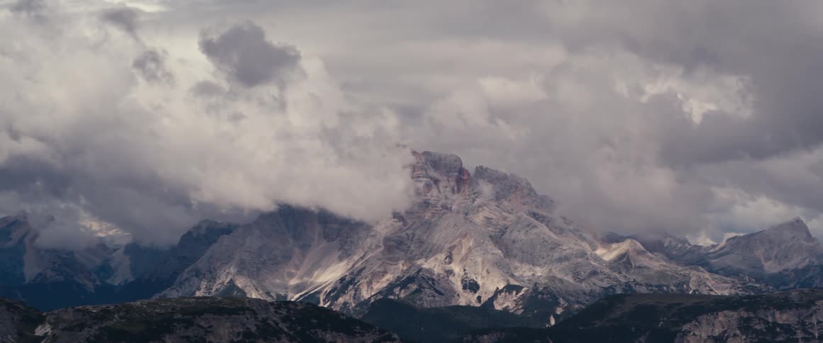 Wild landscape with mountains with snow on the peak