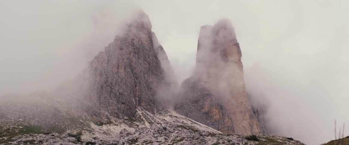 Rock formation covered in fog mist