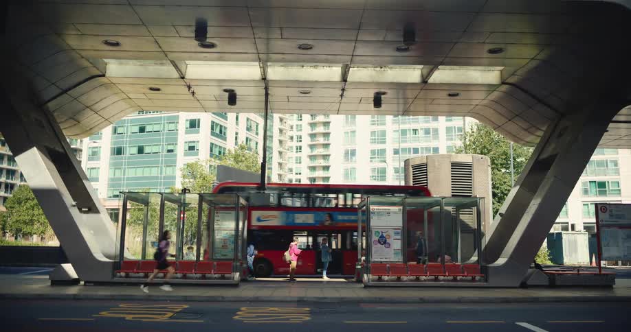 Person running along busy London bus station
