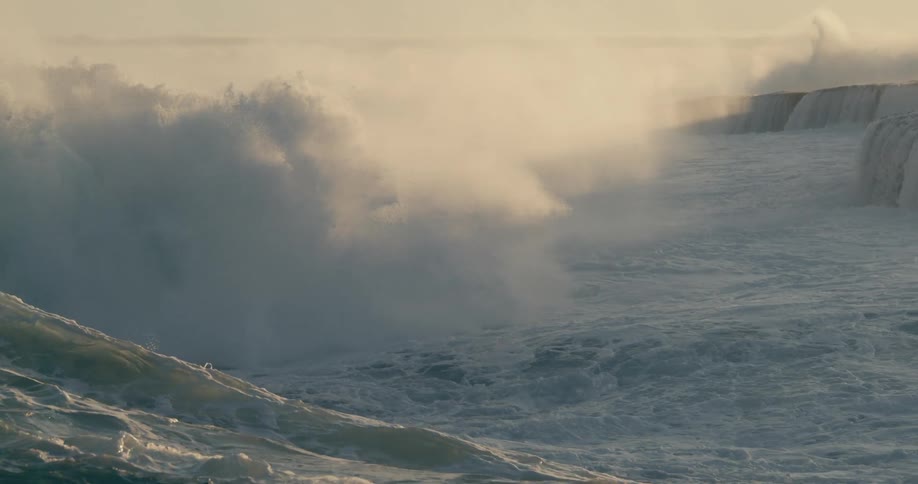 Sea with furious waves crashing on the beach shore