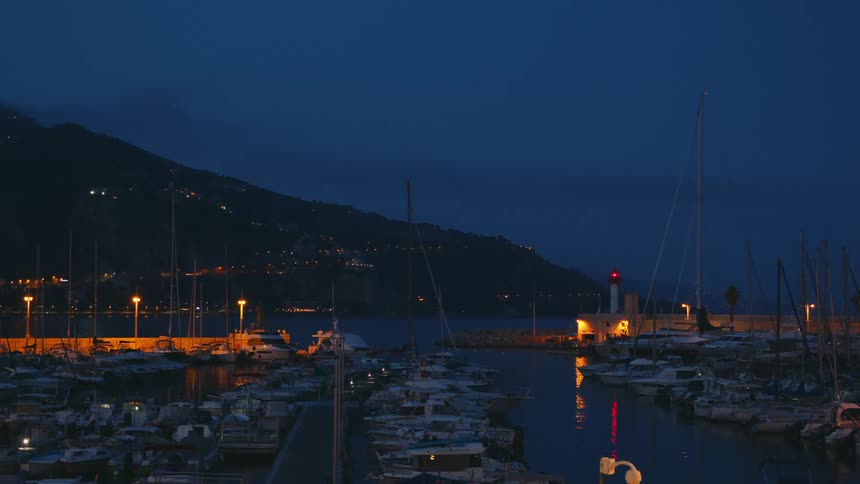 Boats are all docked at night